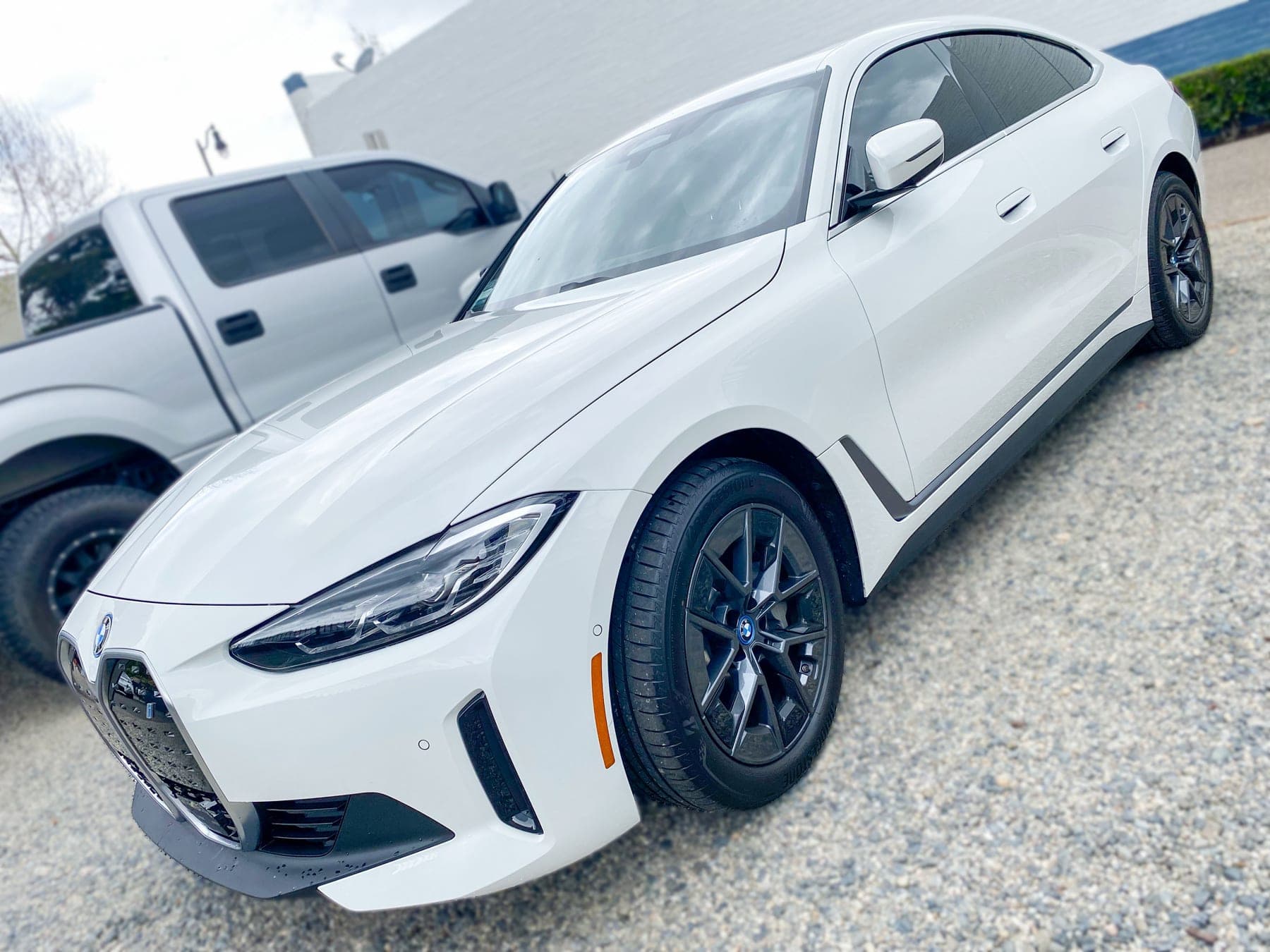BMW i4 with ceramic window tint installed by OC House of Tint
