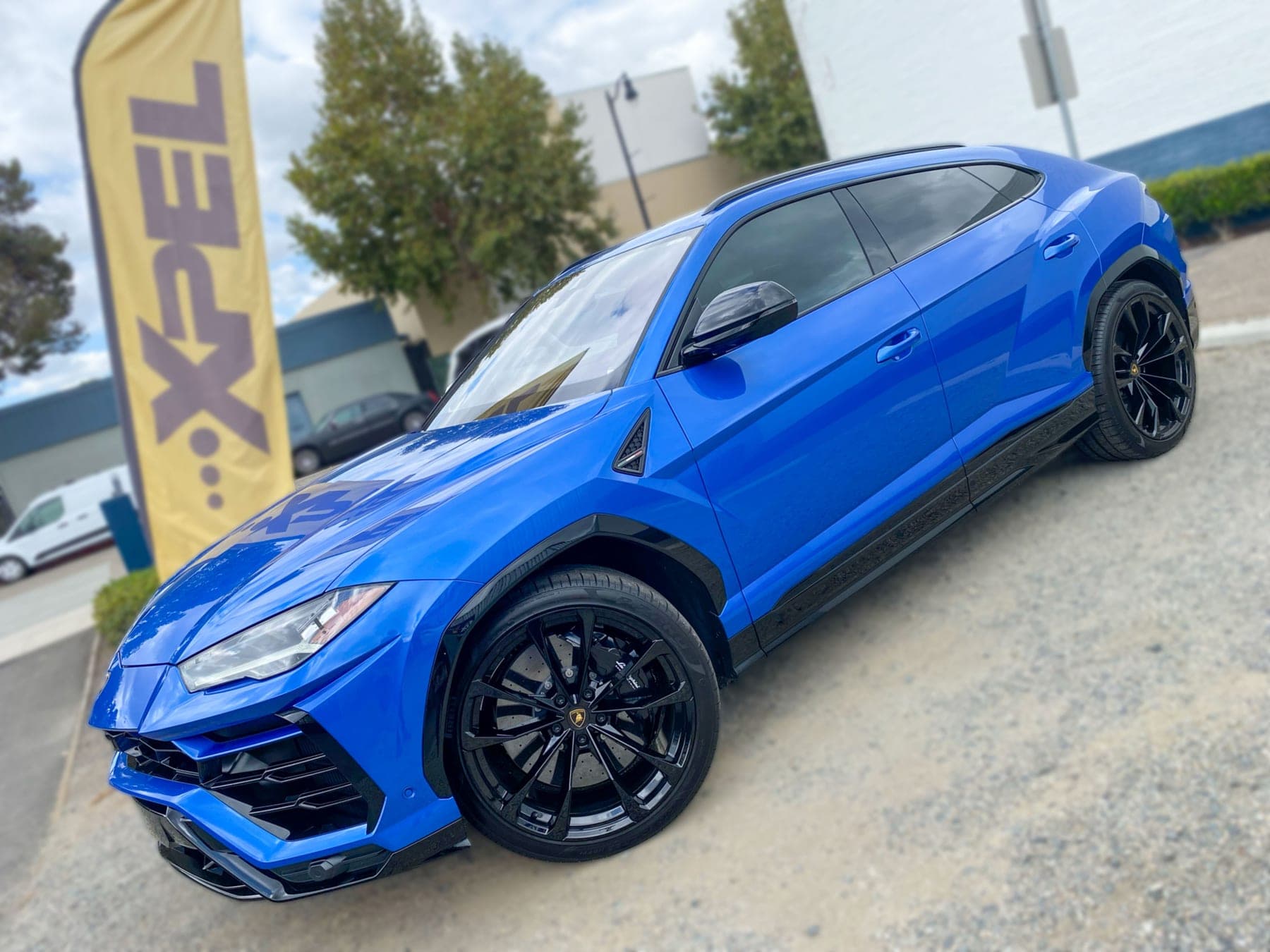 Blue Lamborghini Urus with window tint installed by OC House of Tint