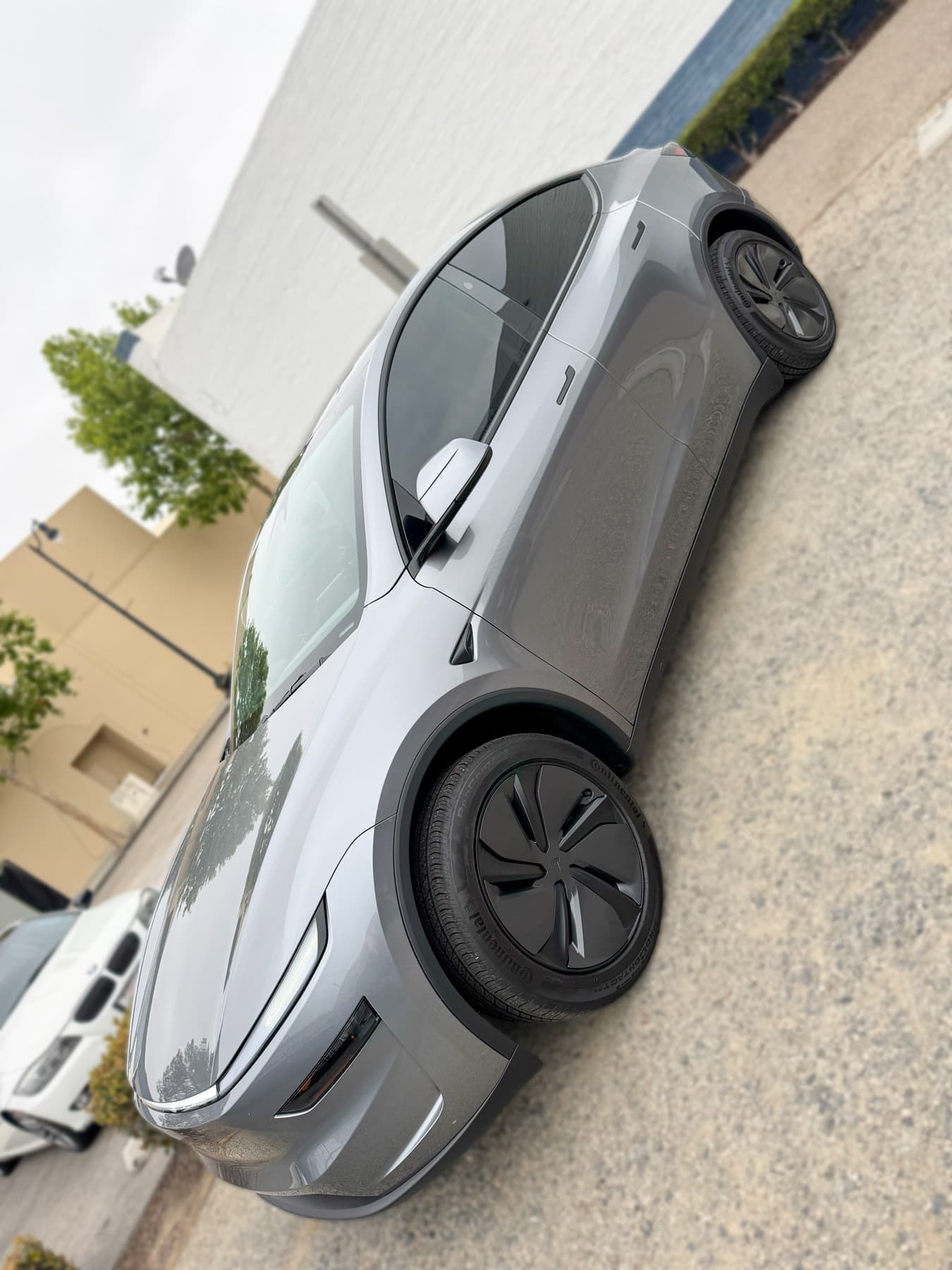 Gray Tesla Model Y with window tint installed by OC House of Tint