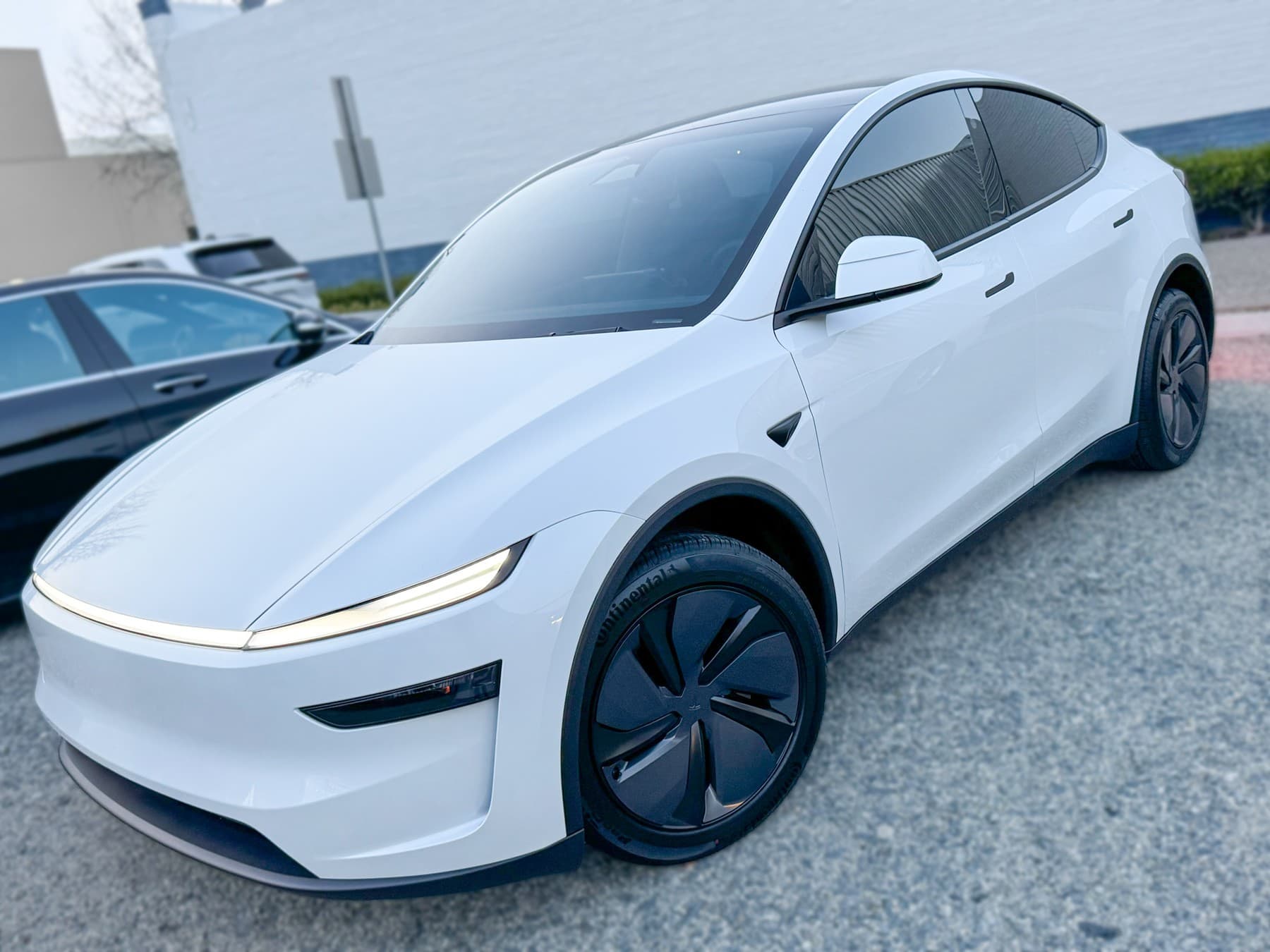 White Tesla Model Y with window tint installed by OC House of Tint