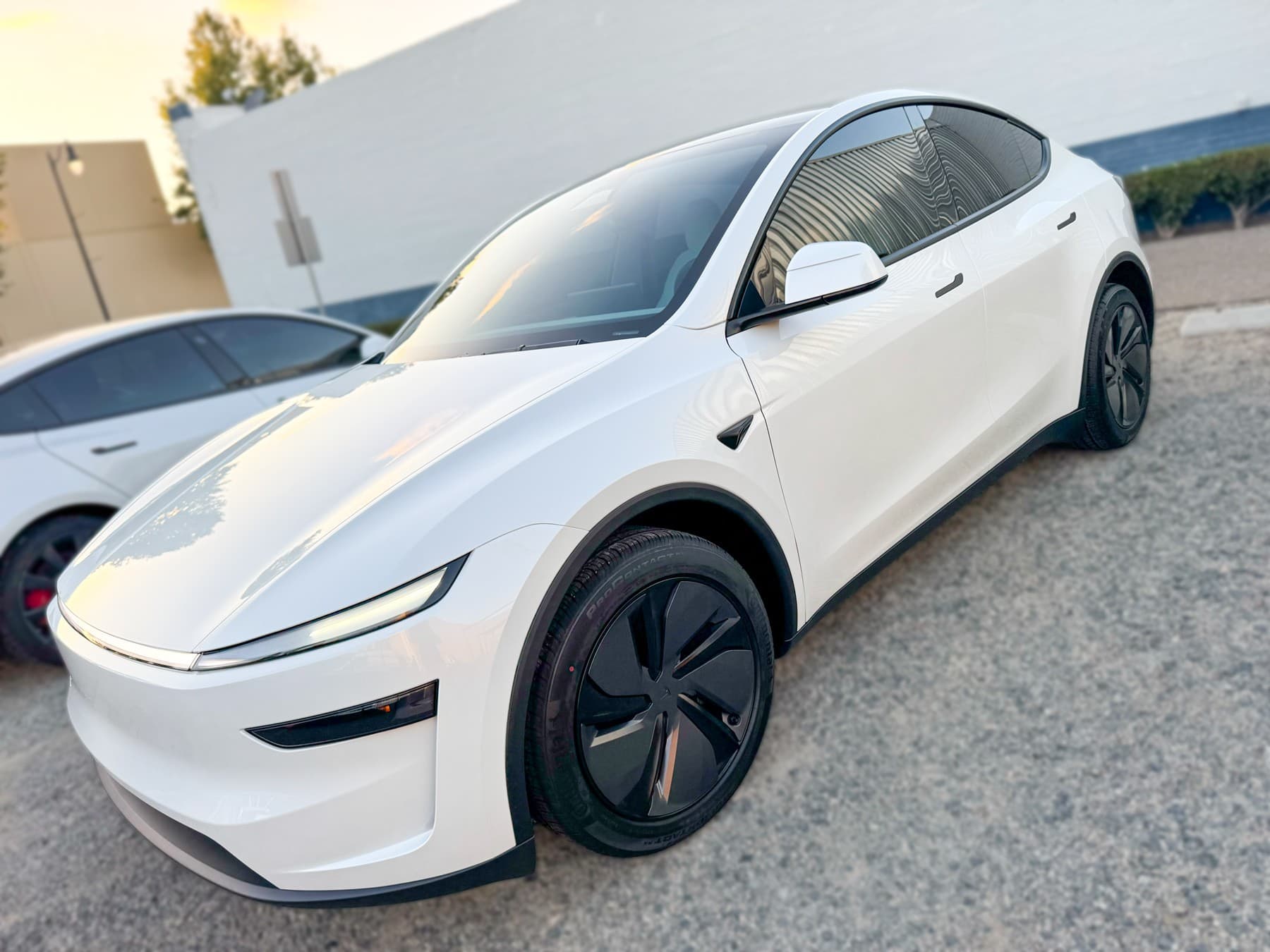 White Tesla Model Y side glass with window tint installed by OC House of Tint