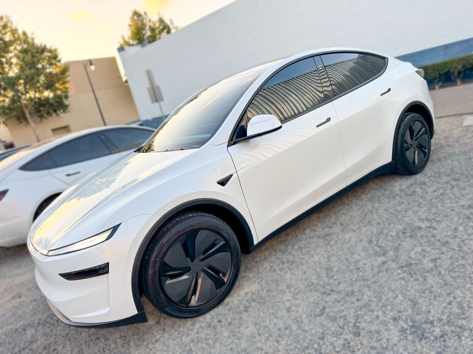 White Tesla Model Y with window tint installed by OC House of Tint