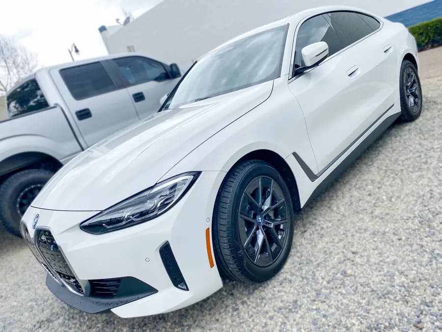 BMW i4 with ceramic window tint installed by OC House of Tint