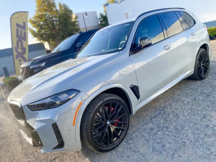 BMW X5 with ceramic window tint installed by OC House of Tint
