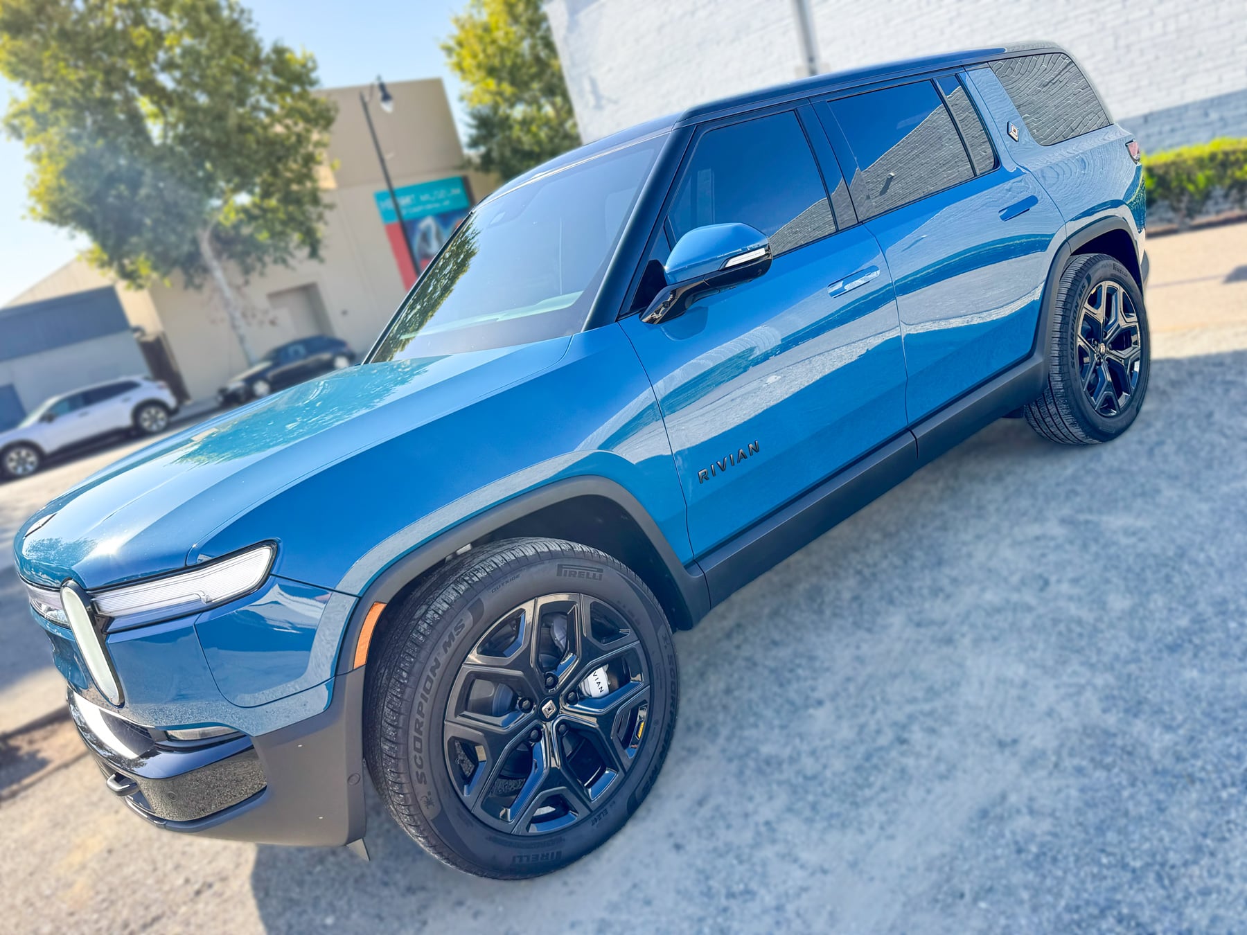 Blue Rivian R1S front three-quarter view at OC House of Tint