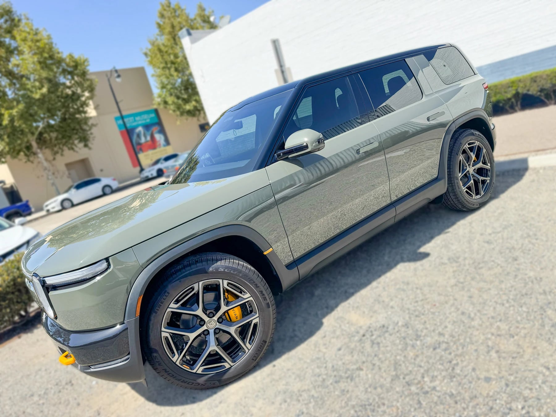Driver-side windows on the completed green Rivian R2 at OC House of Tint