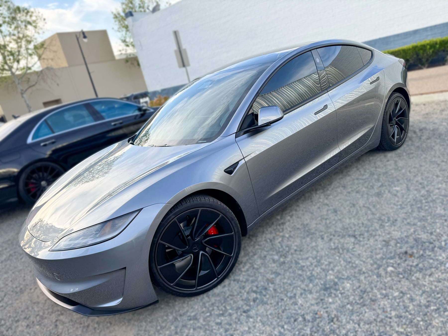 Gray Tesla Model 3 with refreshed front styling and window tint at OC House of Tint