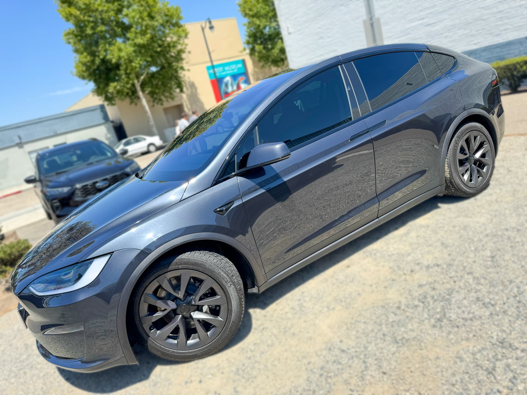 Black Tesla Model X side profile and window tint at OC House of Tint