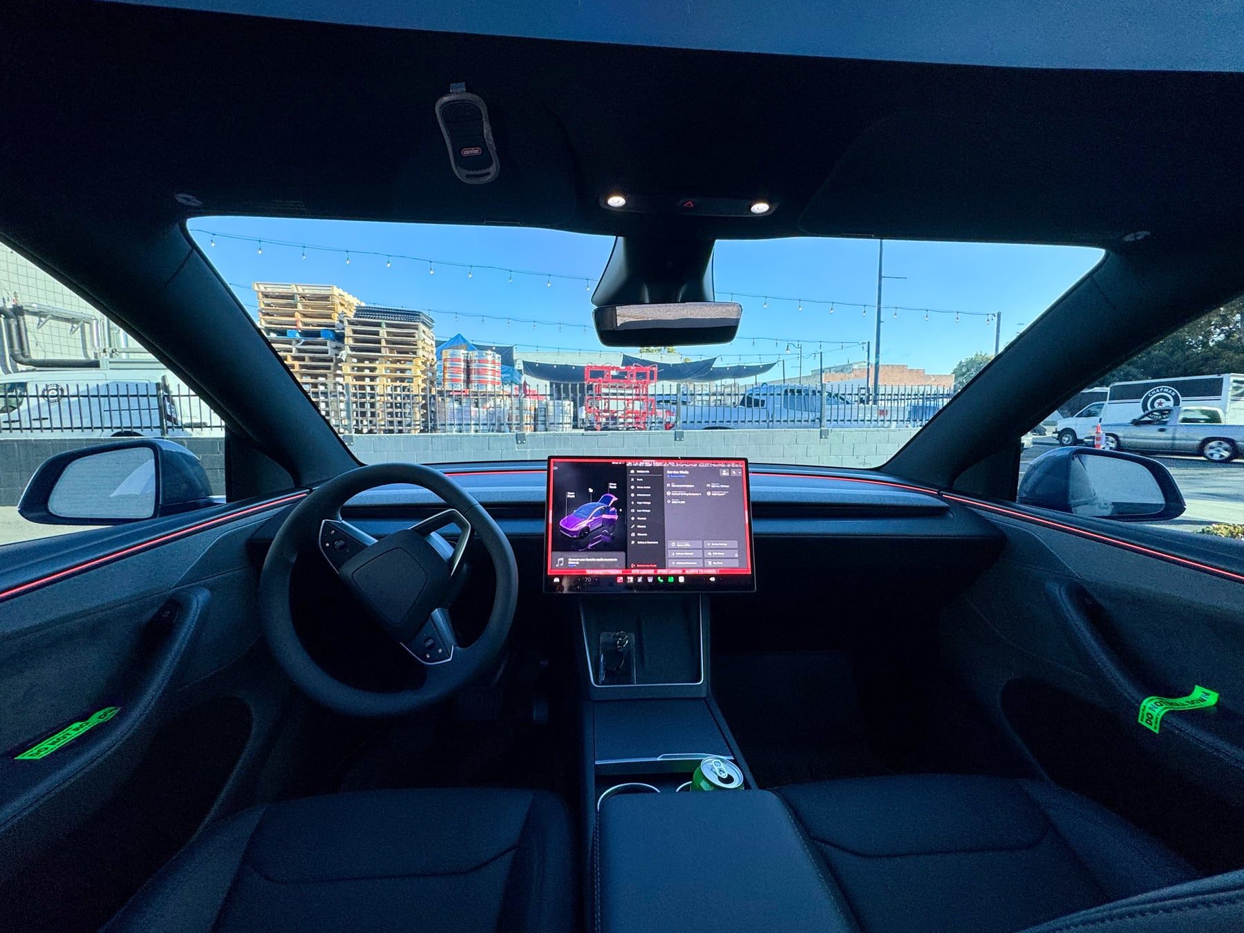 Tesla Model Y black interior showing the windshield and front side glass