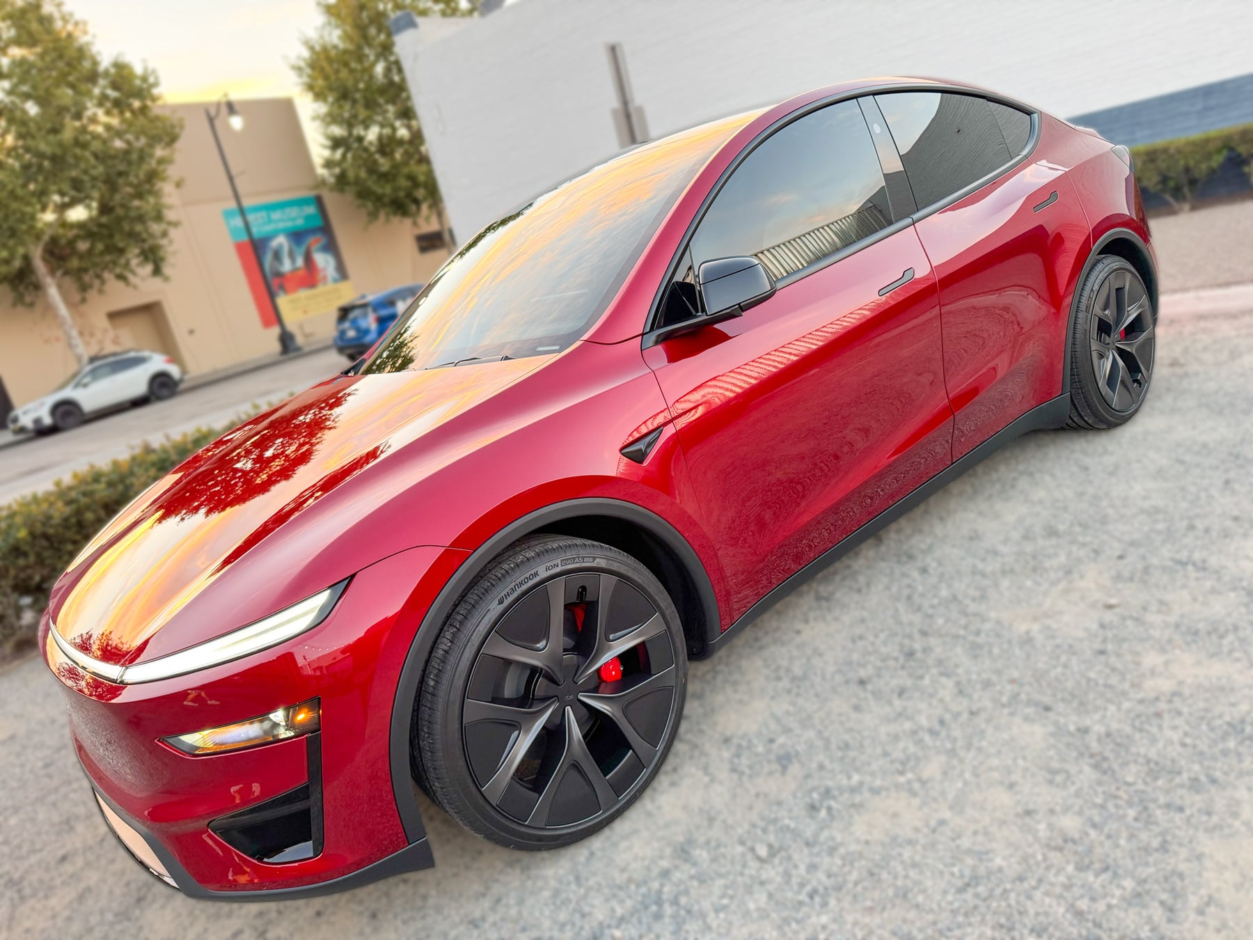 Red Tesla Model Y front three-quarter view at OC House of Tint