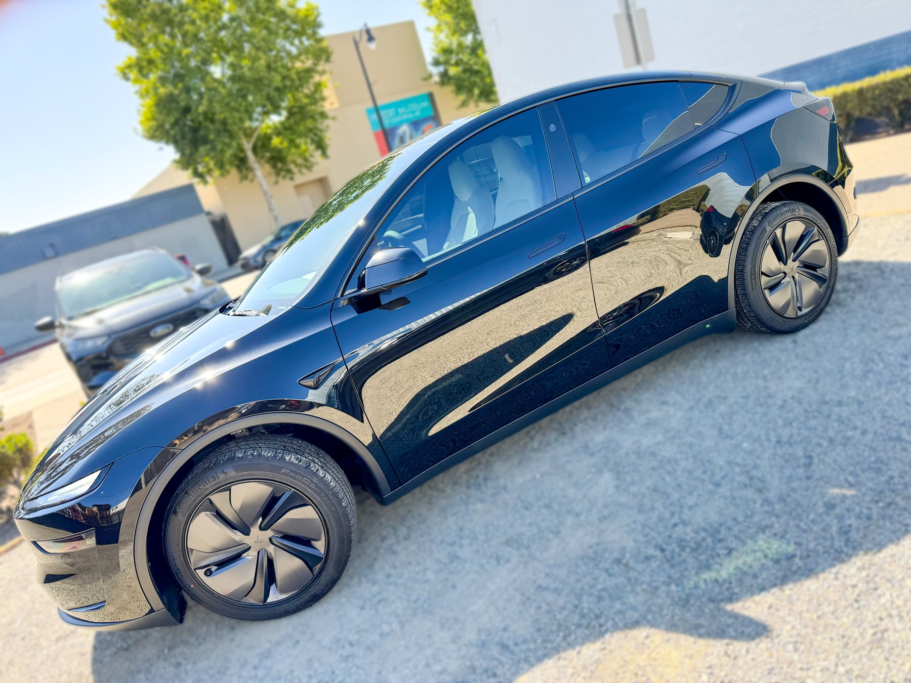 Tesla Model Y side profile with window tint installed by OC House of Tint