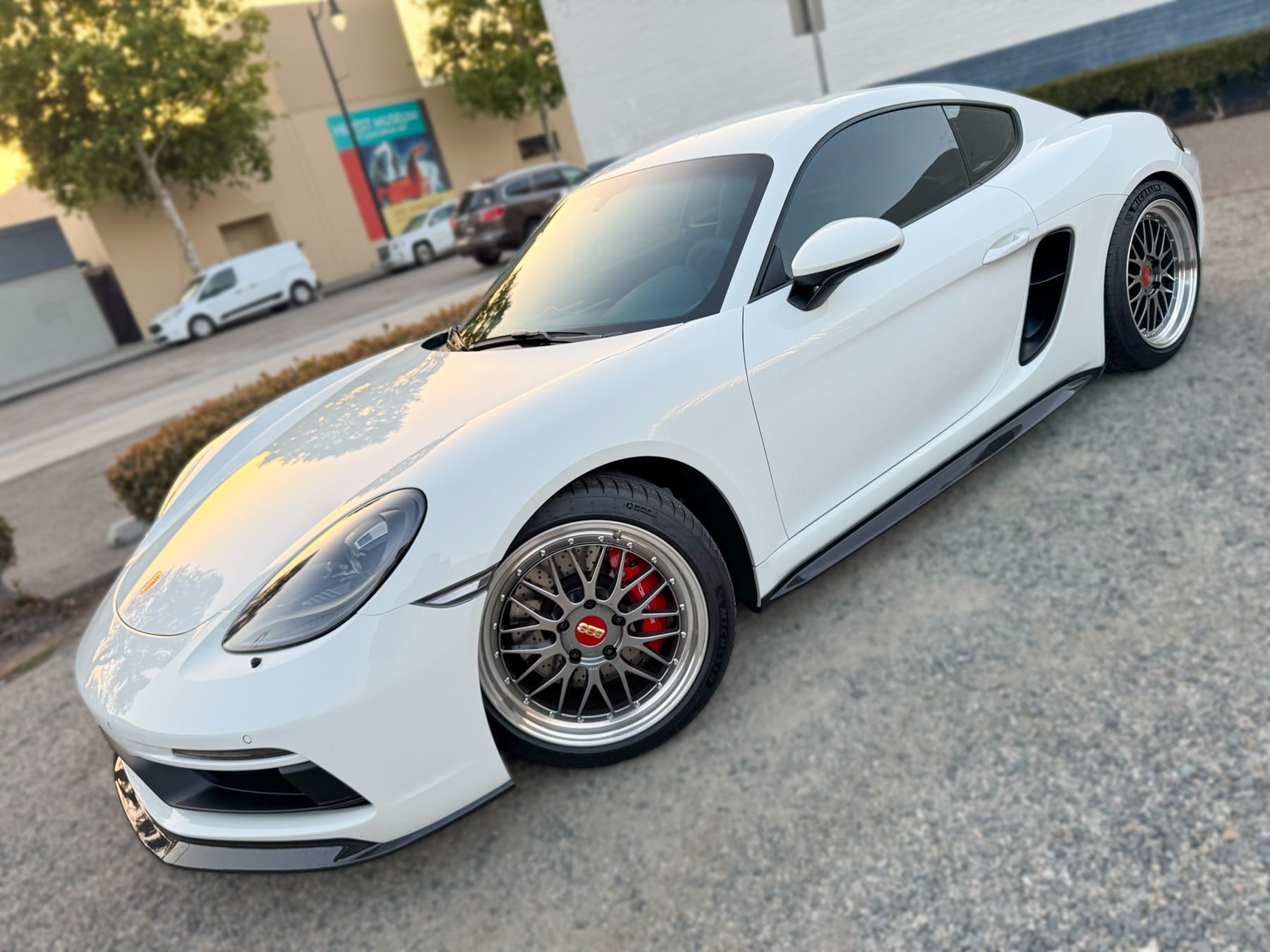 White Porsche 718 Cayman with tinted side glass at OC House of Tint