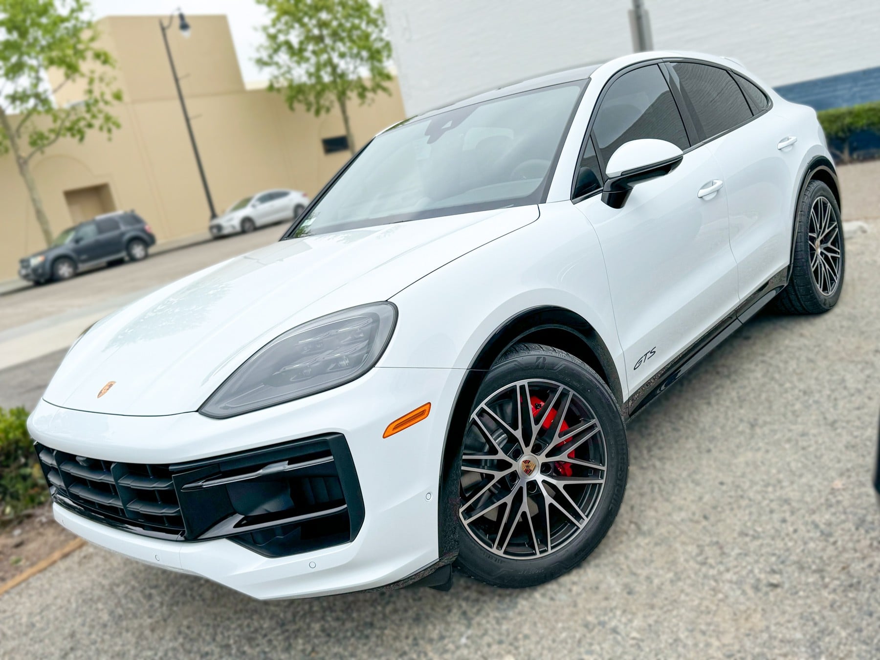 White Porsche Cayenne with completed window tint at OC House of Tint