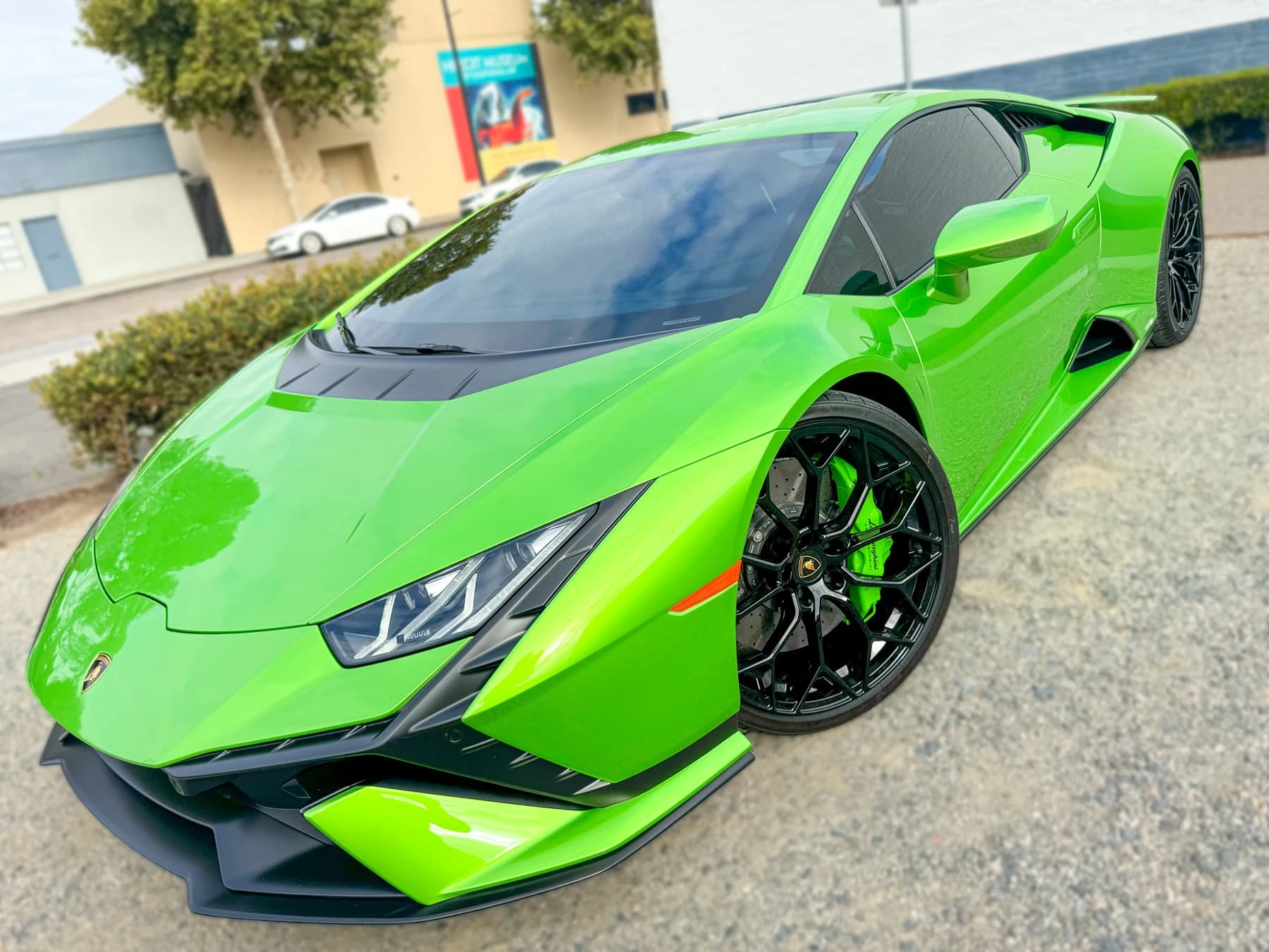 Green Lamborghini Huracán Tecnica front three-quarter view after XPEL XR Plus tint installation at OC House of Tint