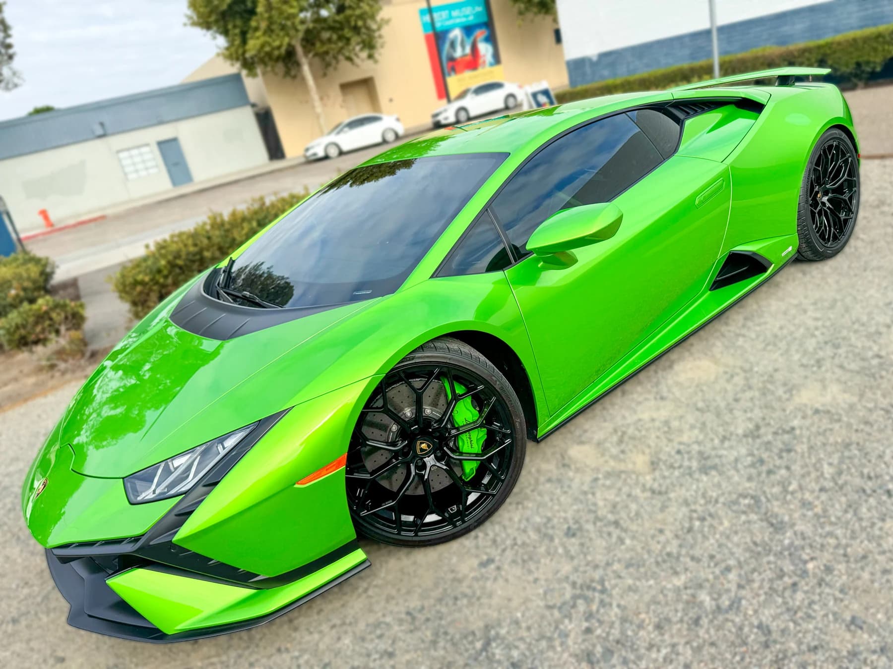 Green Lamborghini Huracán Tecnica side and front view after XPEL XR Plus tint installation at OC House of Tint