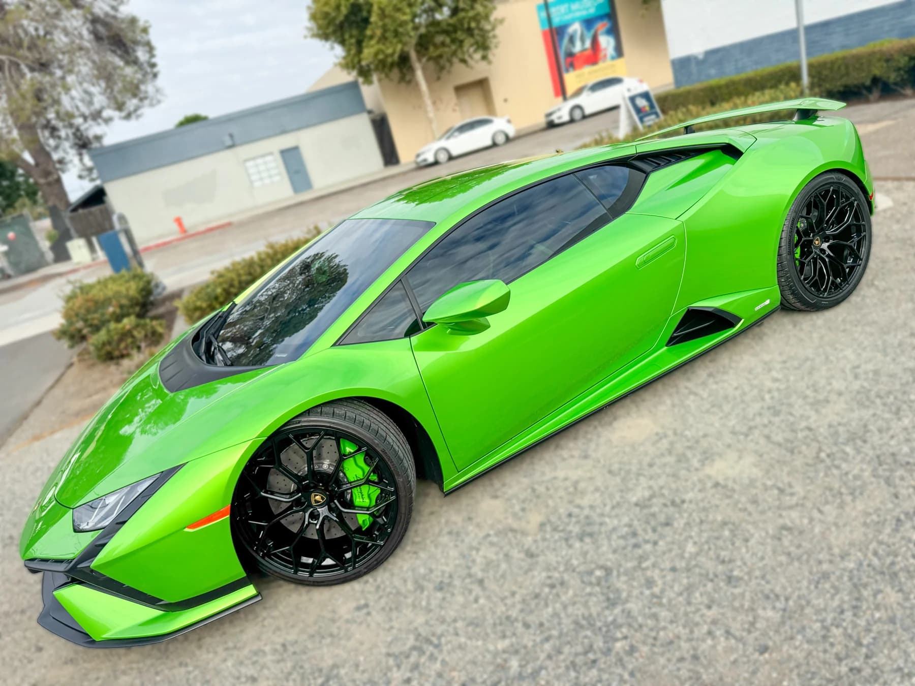 Green Lamborghini Huracán Tecnica side profile after XPEL XR Plus tint installation at OC House of Tint