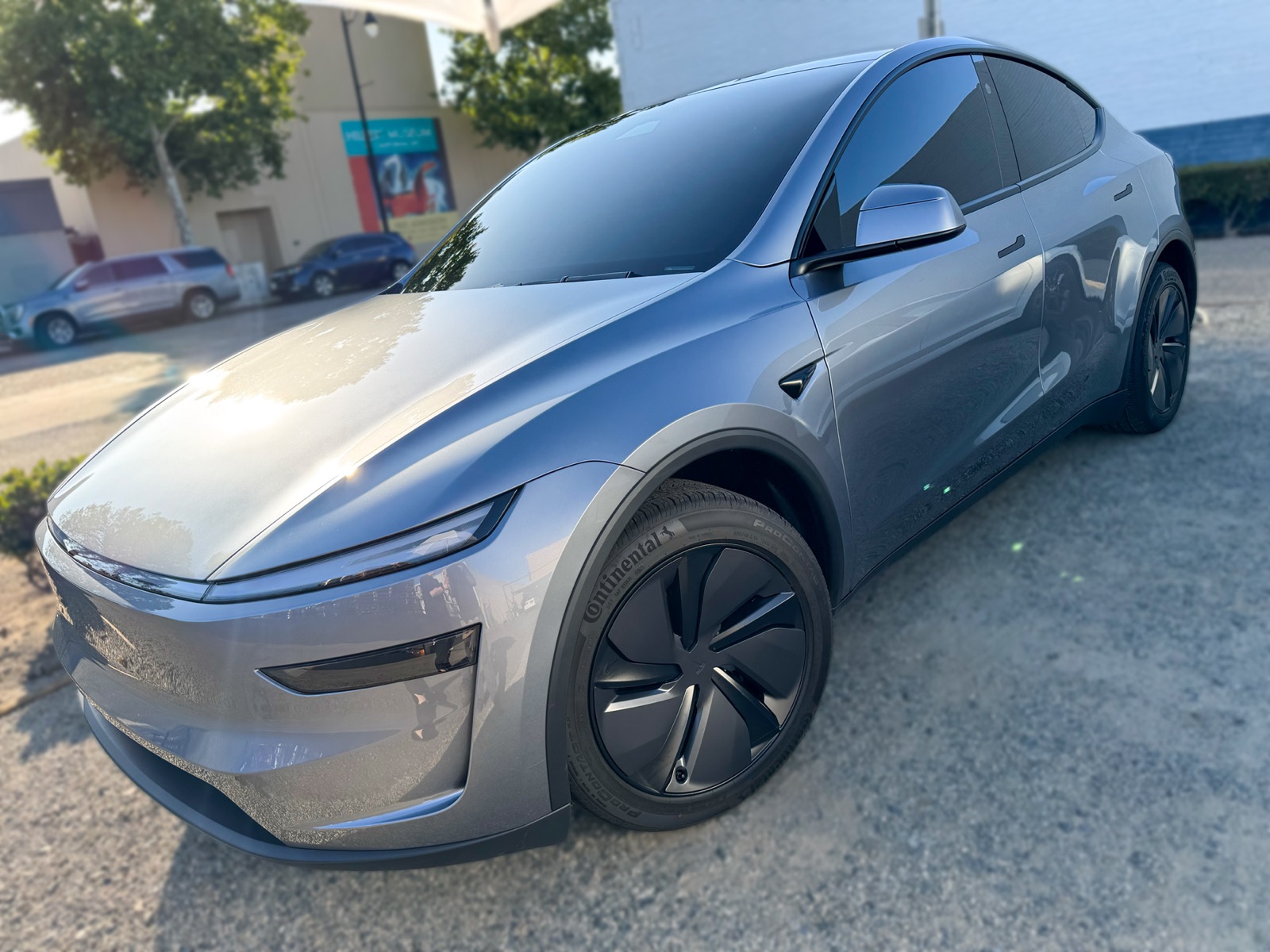Gray Tesla Model Y with window tint shown from the front angle at OC House of Tint