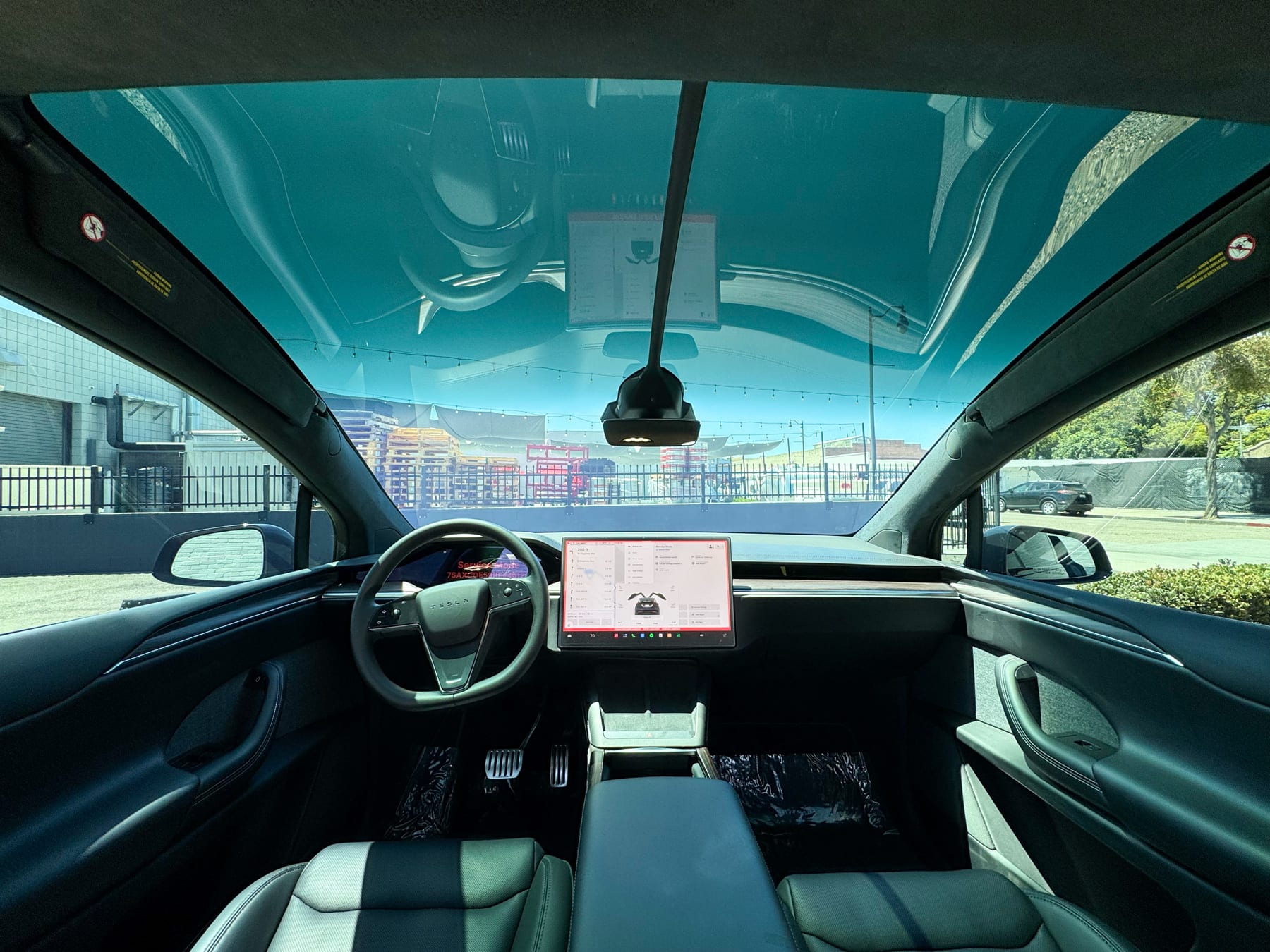 Tesla Model X panoramic windshield one-piece 50 percent tint interior view