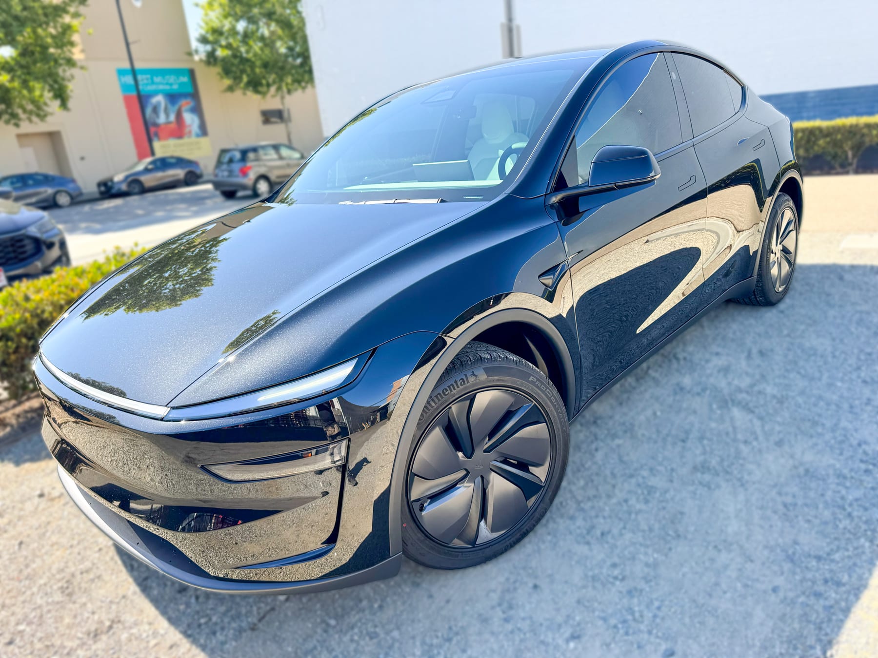 Tesla Model Y front angle with window tint installed by OC House of Tint